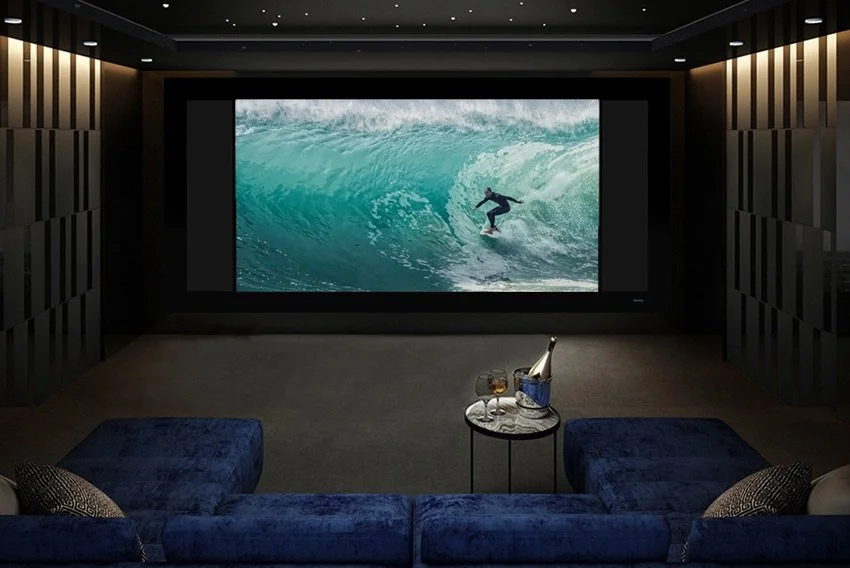 Dedicated private cinema with a Stewart Filmscreen masking screen and blue velvet theater seating | VIP Smart Homes Seattle