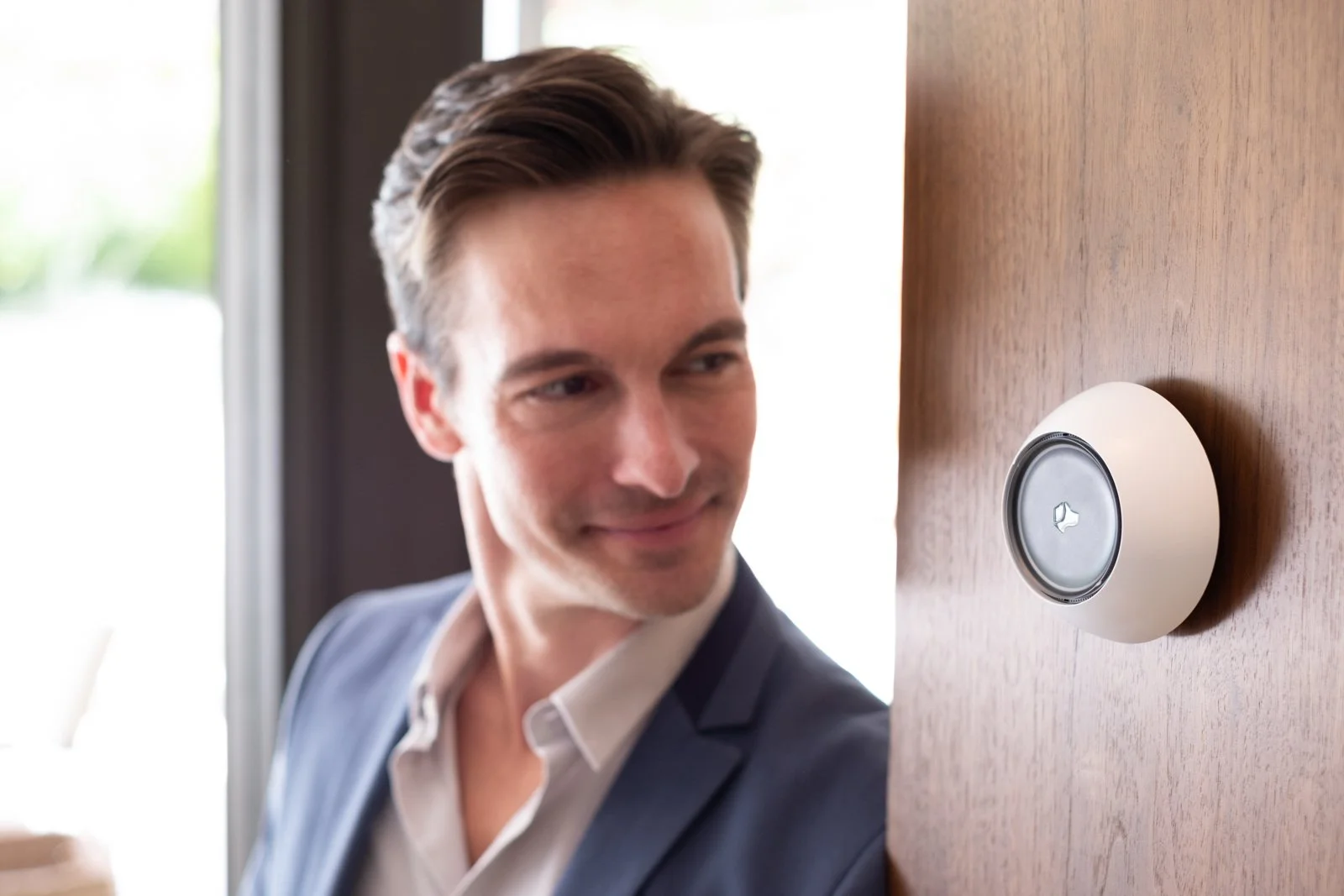 Josh Micro wall mounted in the entry way of a luxury home | Josh.ai dealer Seattle and Bellevue