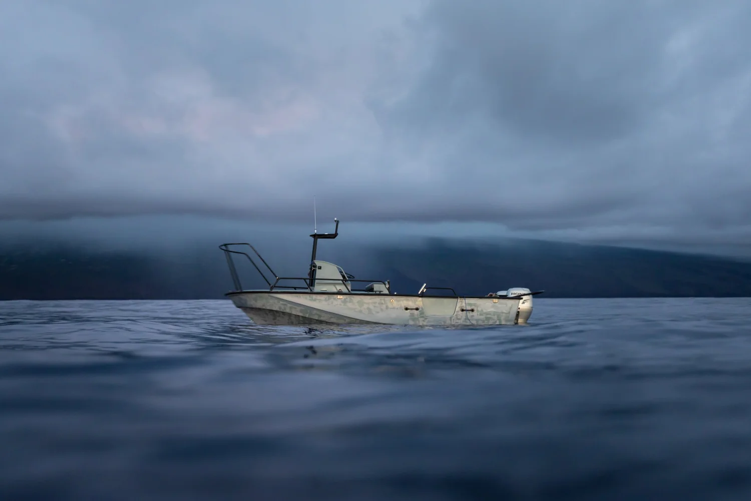 Cory's Whaler Guardian offshore at dusk under low cloud