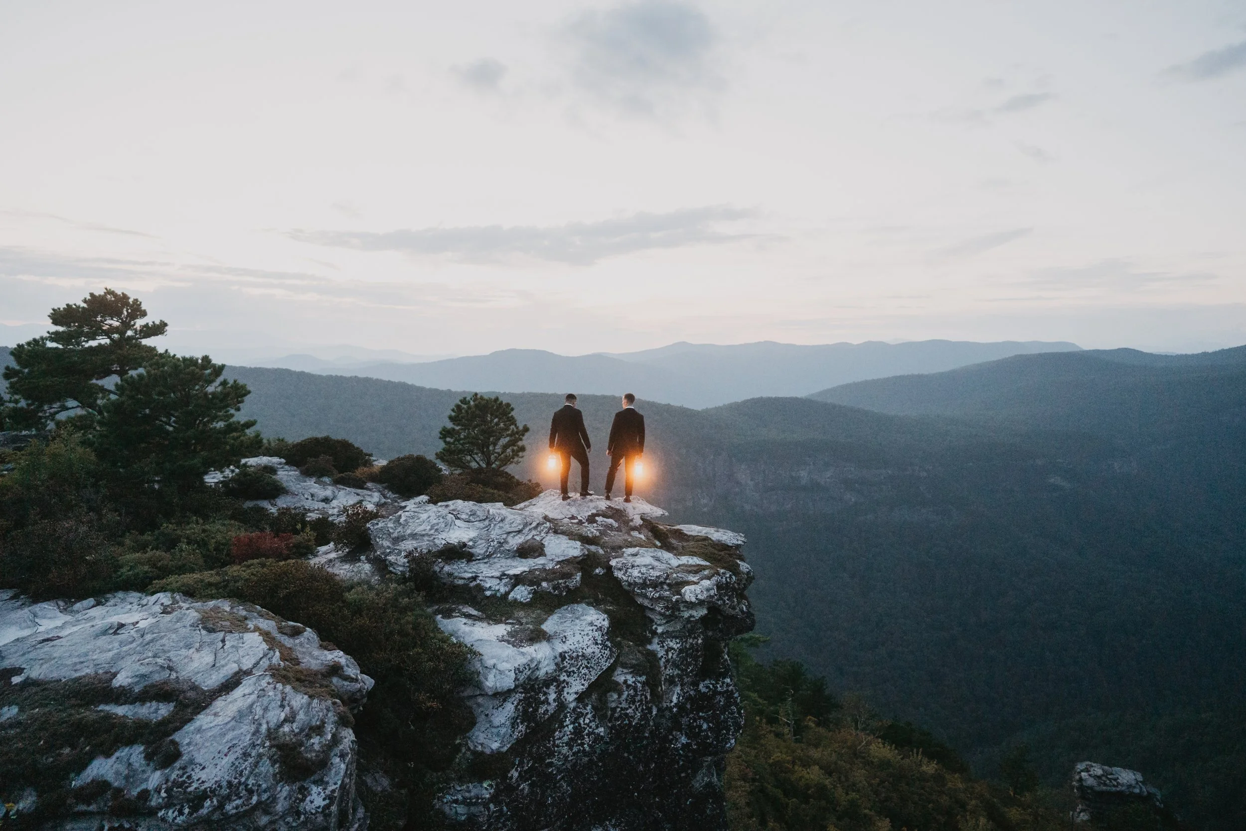 David and Jimmy together at The Chimneys with mountain views during their Adventure Session