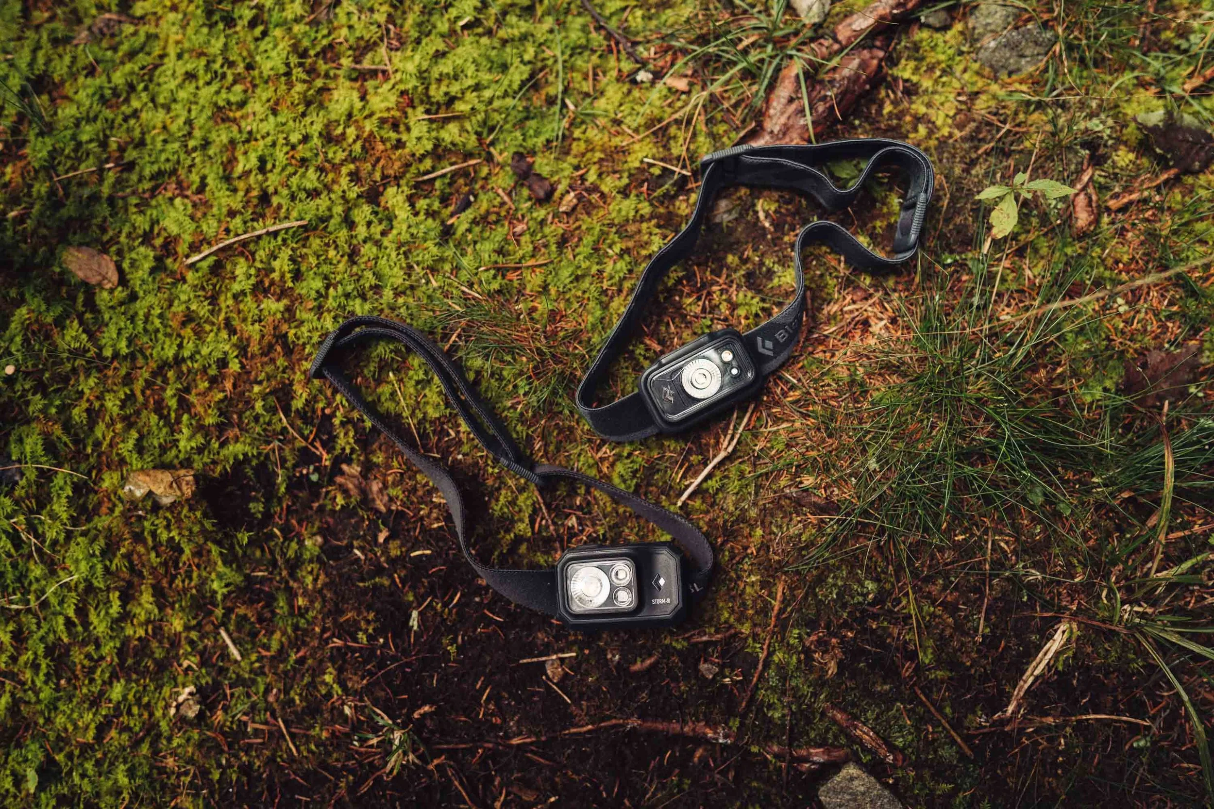 Couple wearing headlamps during a mountain elopement hike after dark