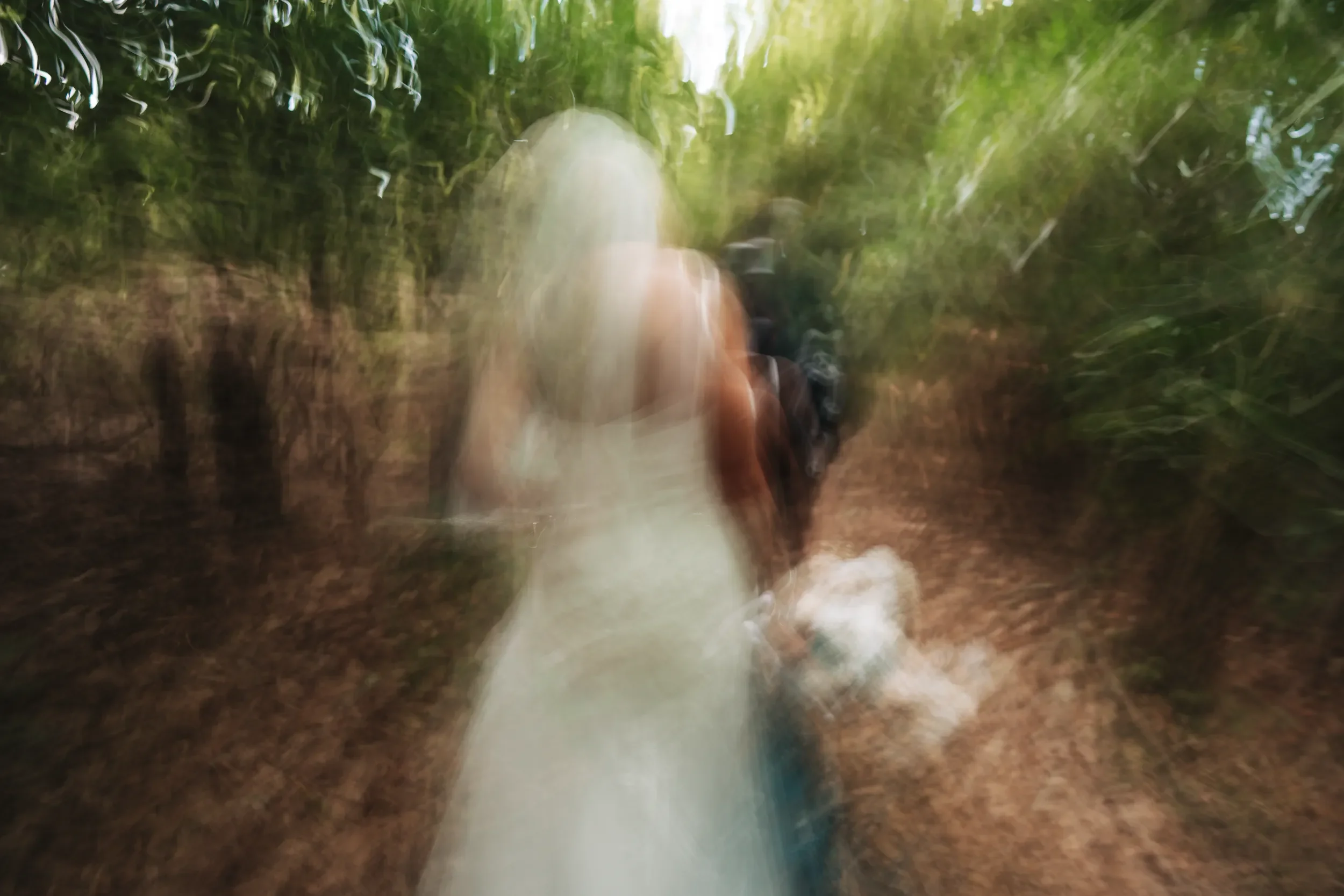 Dawn and Shane moving through the mountain landscape during their elopement session