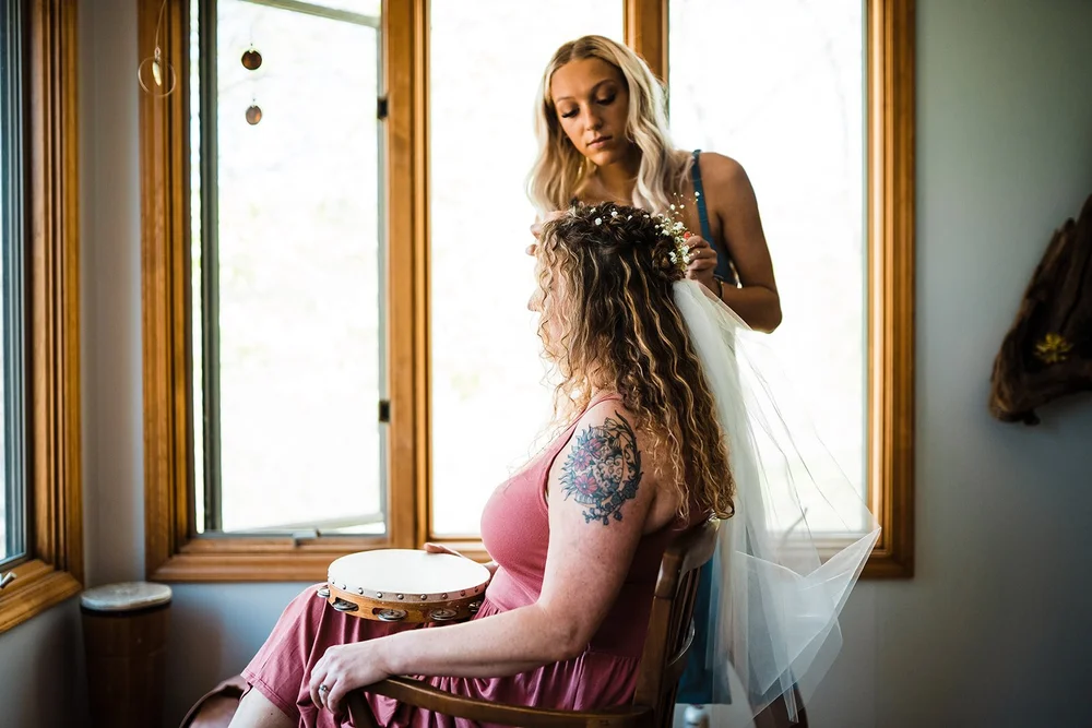 Kimb having her veil placed while getting ready at the cabin before her wedding