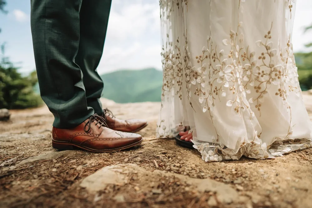 Mackenzie's wedding dress and hiking shoes before her small mountain wedding ceremony.
