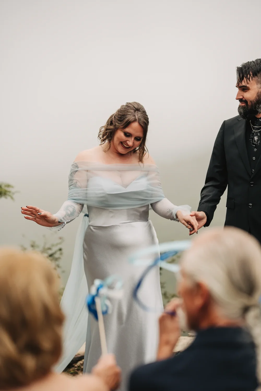 Bryanna wearing her misty silver-blue wedding dress and custom cape