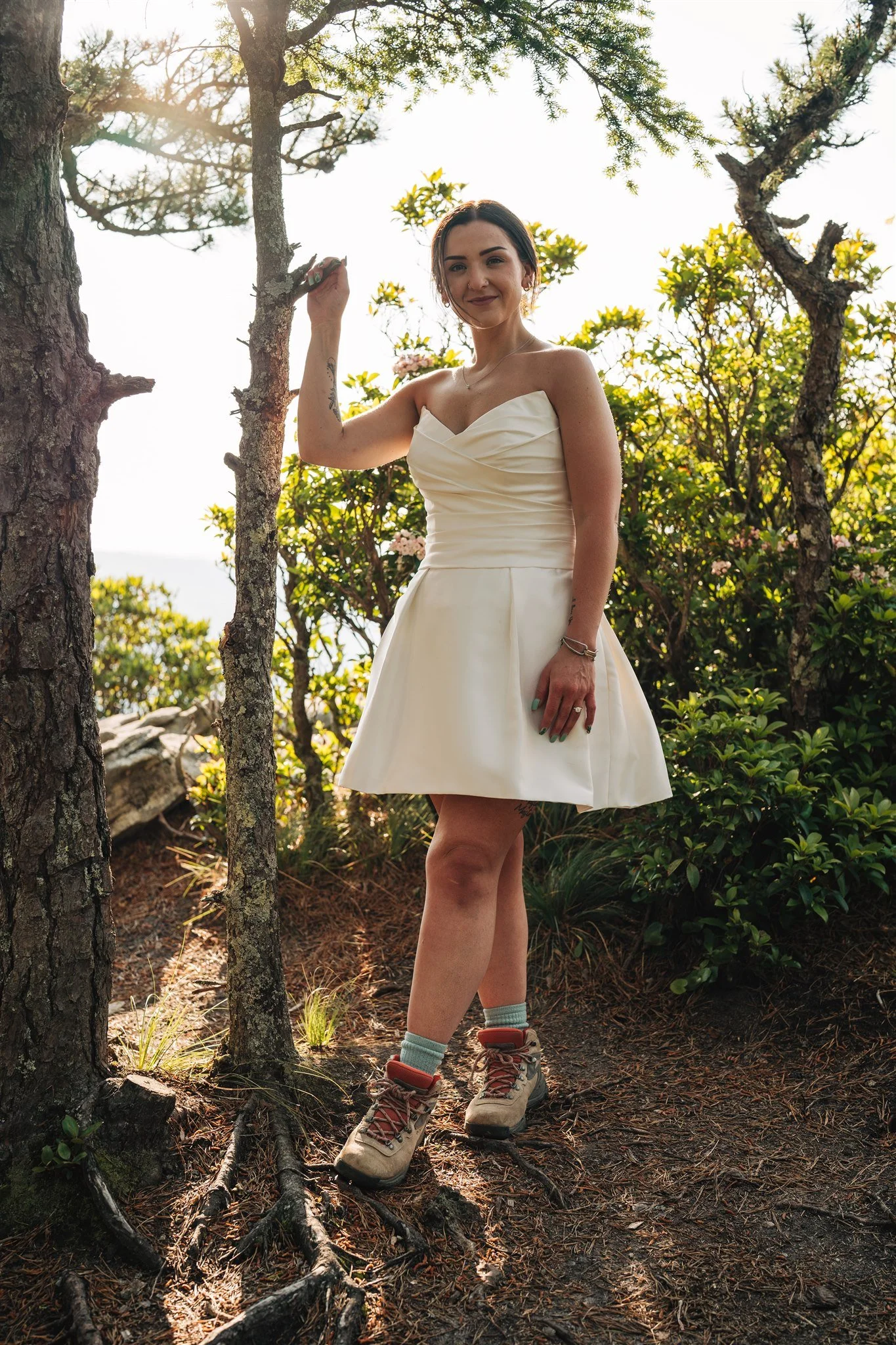 Bride wearing a convertible wedding skirt while walking outdoors during a mountain elopement