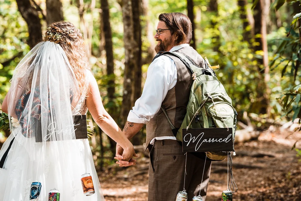 Kimb and Roland celebrating after their wedding before heading into the mountains