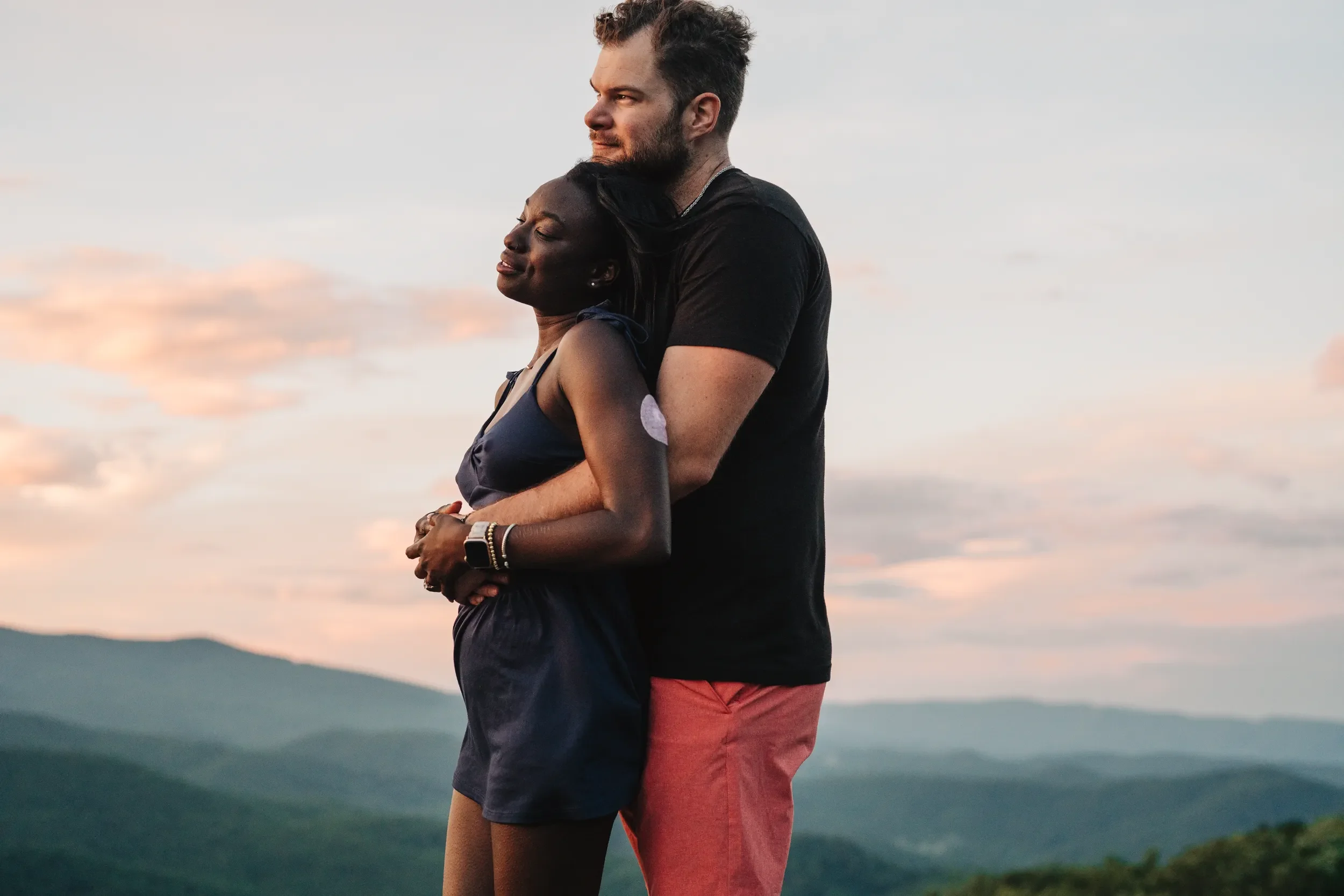 Wesley and Danielle standing together after their surprise proposal near Linville Gorge