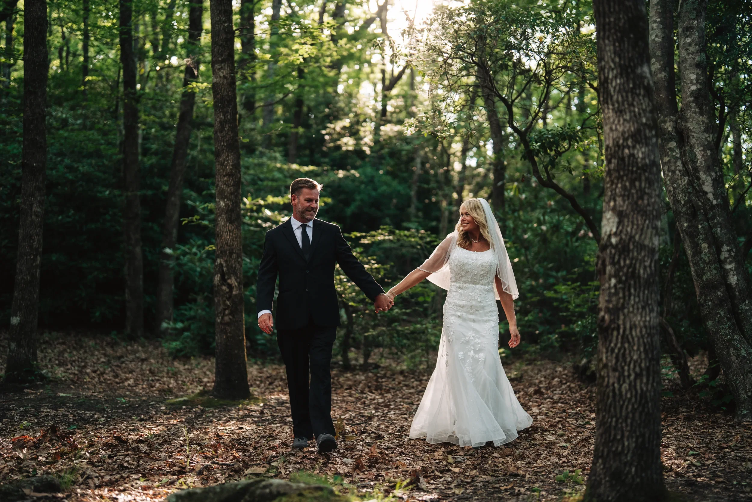 Dawn and Shane looking out over the mountains during their elopement session near Marion North Carolina