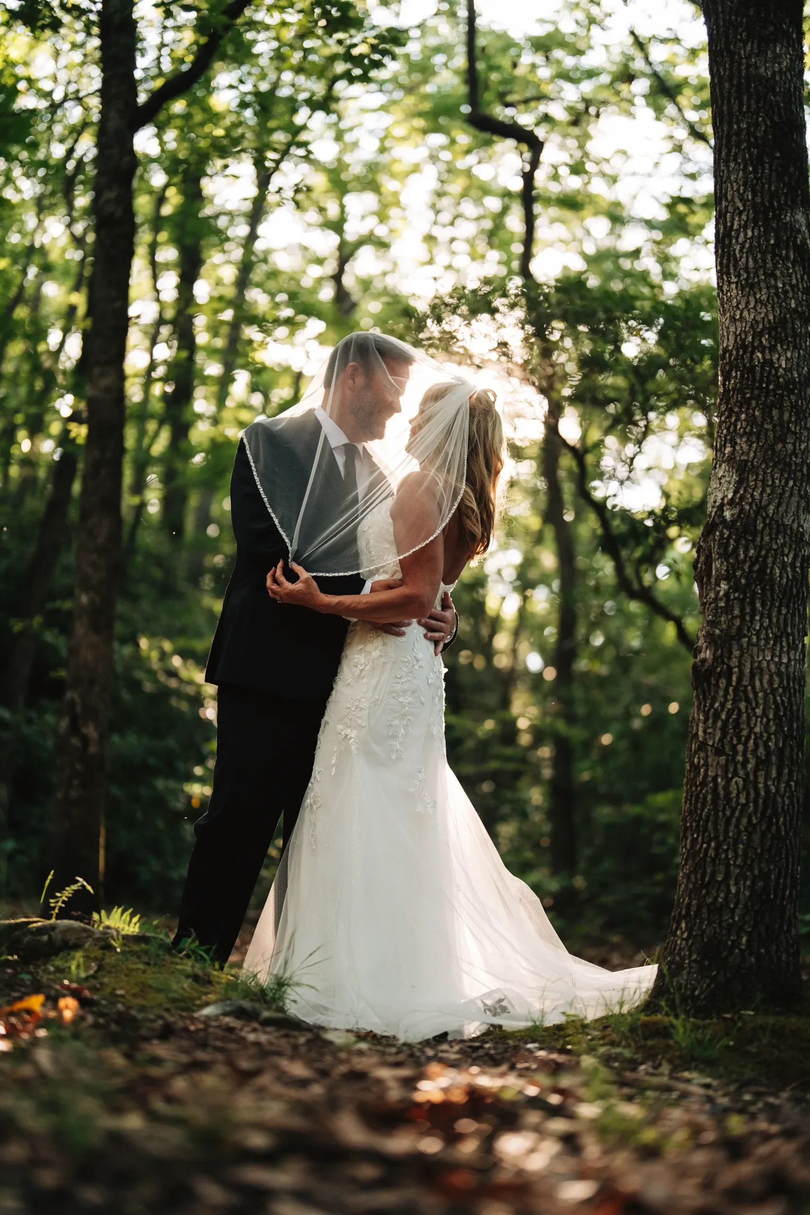 Dawn and Shane sharing a quiet moment during their mountain elopement portraits in Western North Carolina