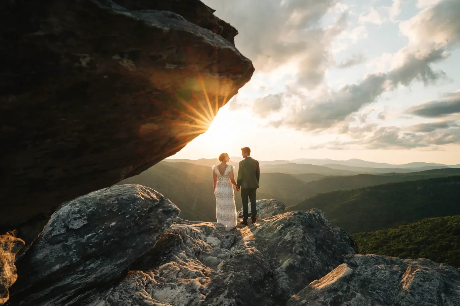 Mackenzie and Michael standing together during sunset portraits on Hawksbill Mountain.