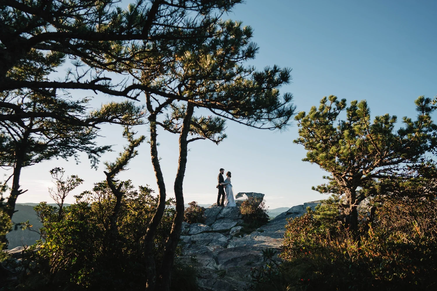 Bryanna's custom cape moving in the wind during a Hawksbill Mountain adventure session