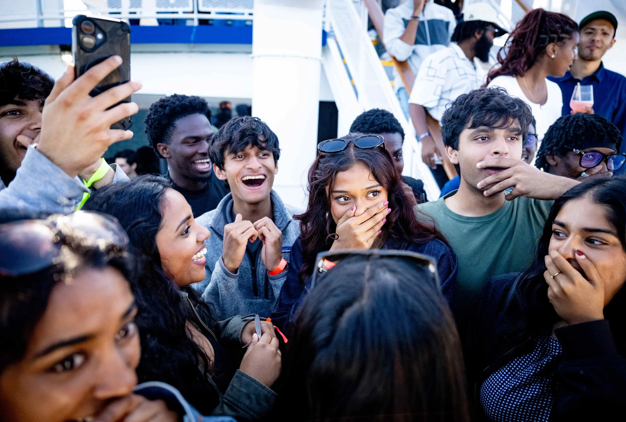 Guests reacting with astonishment to close-up magic