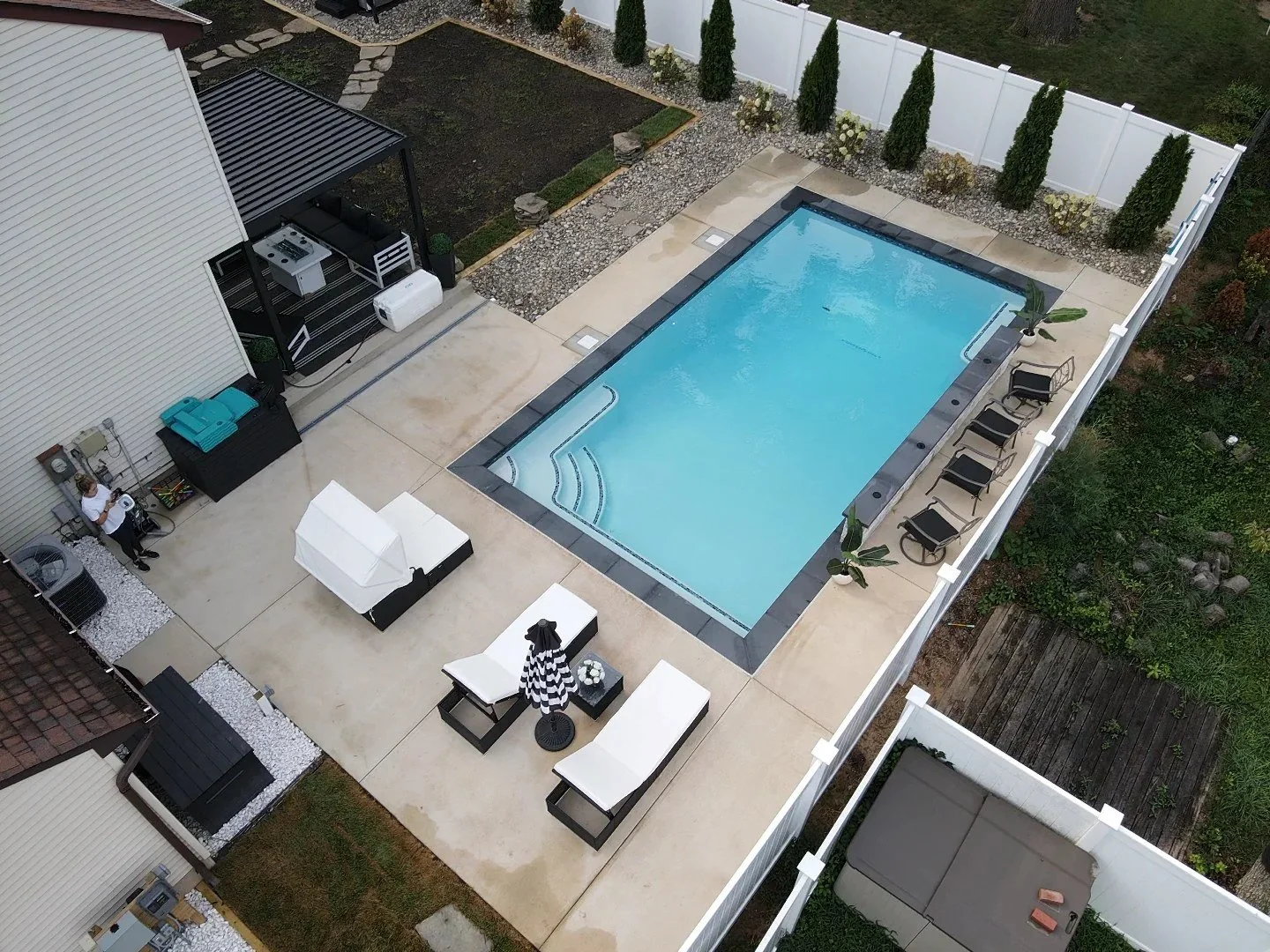 Overview of an Annapolis backyard with a rectangular Oasis swimming pool