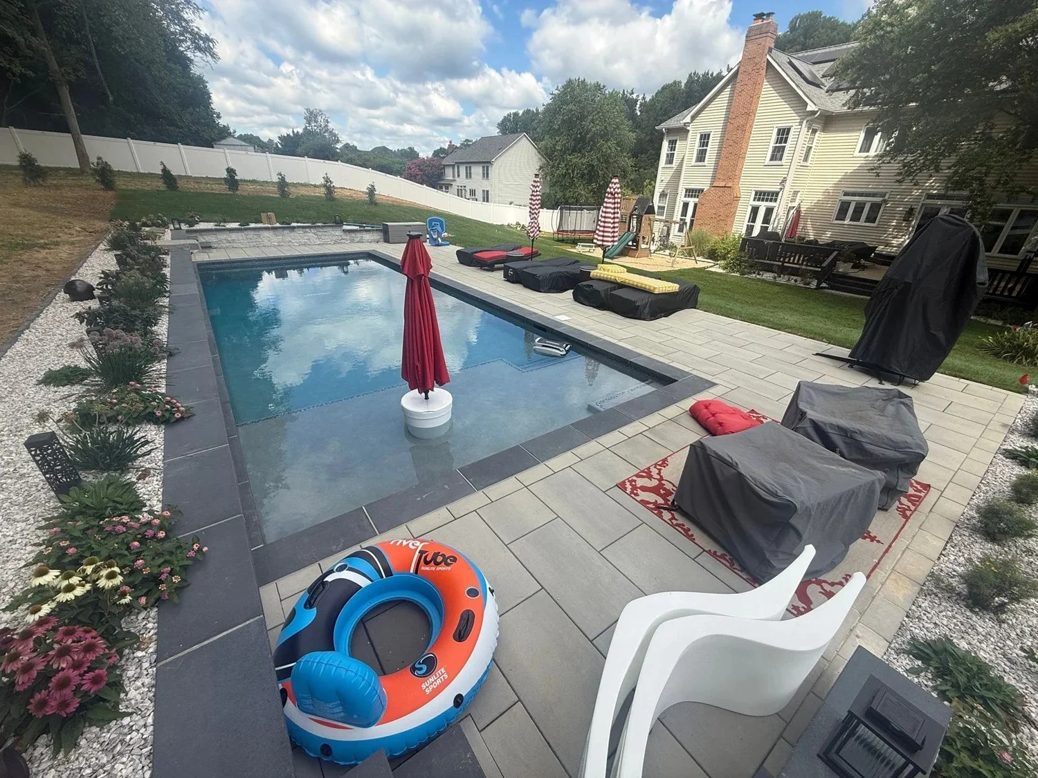 Davidsonville pool with tanning ledge, umbrella and space for poolside seating