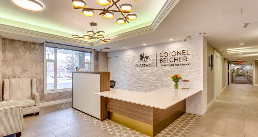 A calm design feature wall in the lobby of a retirement residence.