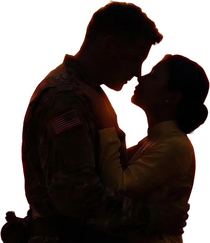 Silhouette of a soldier and a woman embracing.