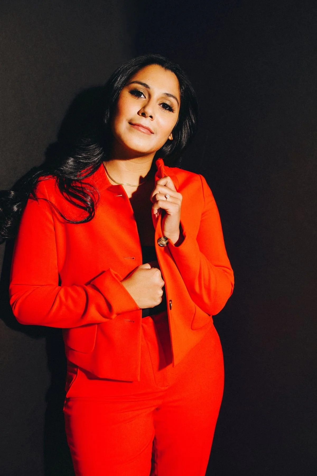 Mariangelica Forero in a red suit