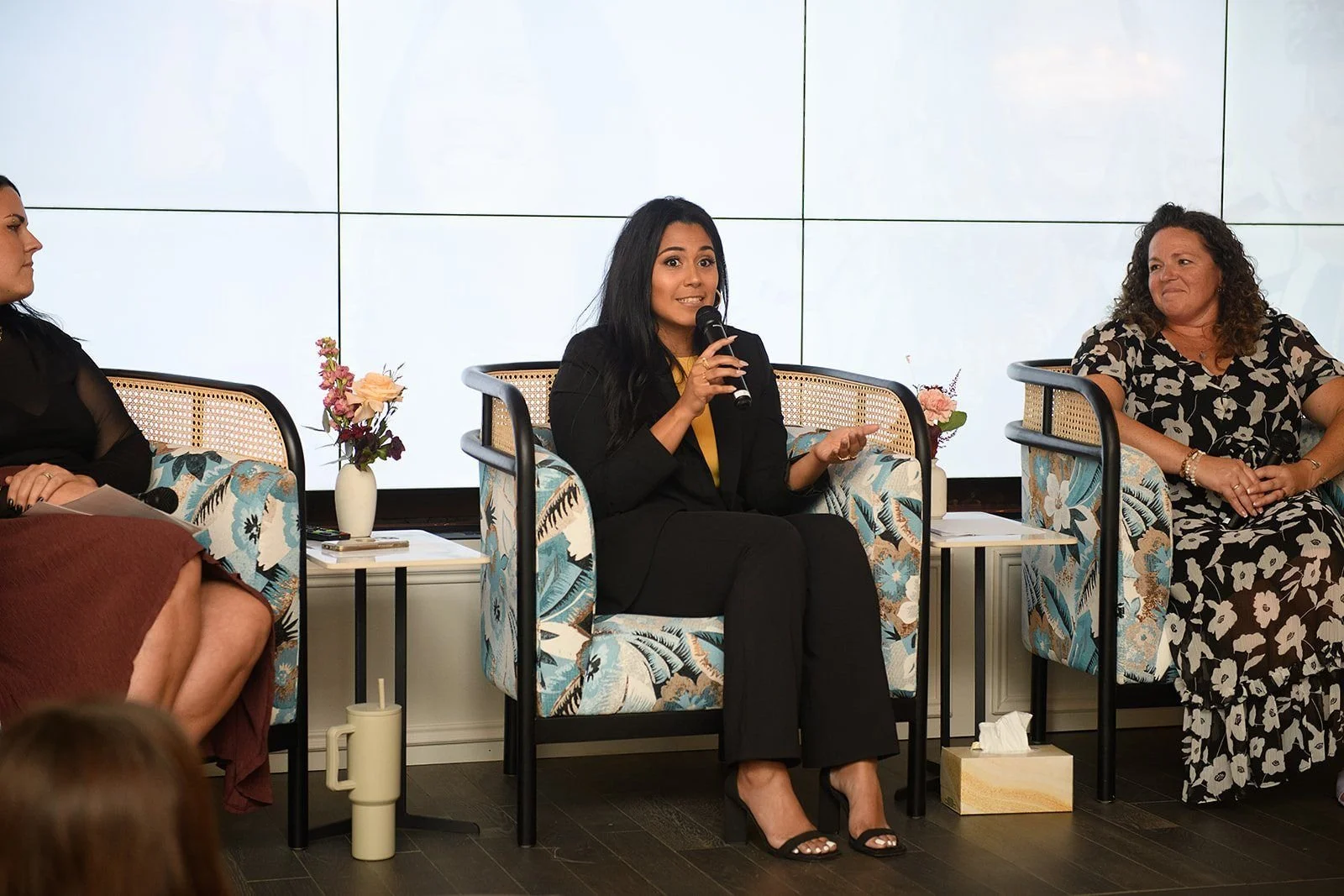 Mariangelica speaking on a panel