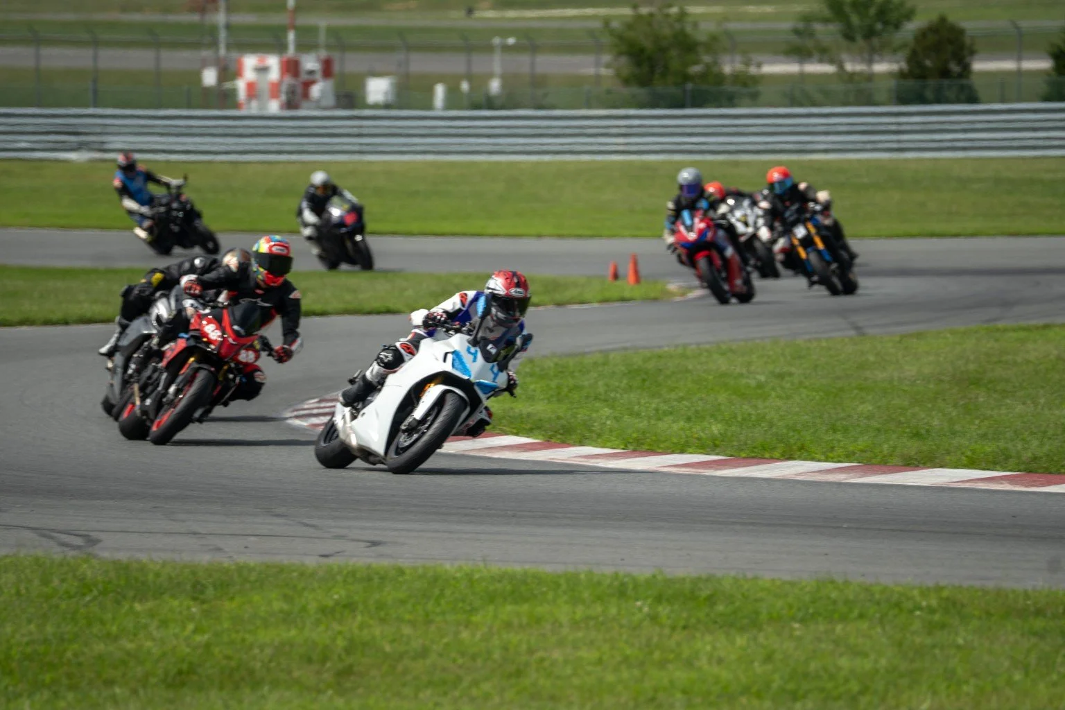 Riders sharing a corner during a track session