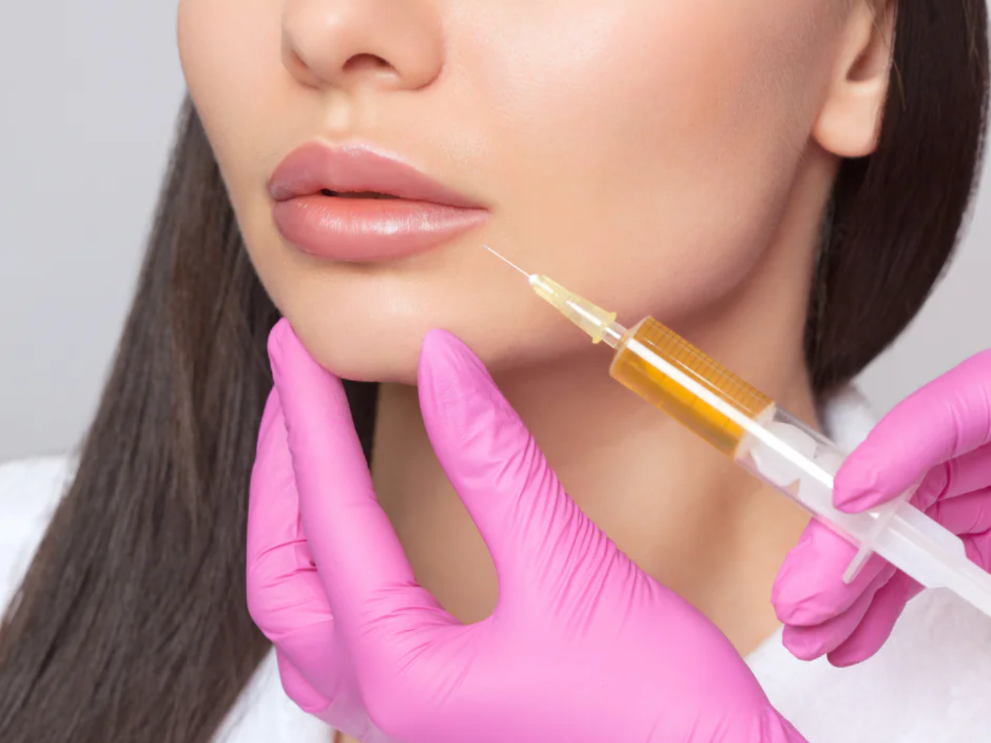 Clinician preparing platelet-rich plasma (PRP) from a blood sample for PRP facial treatment