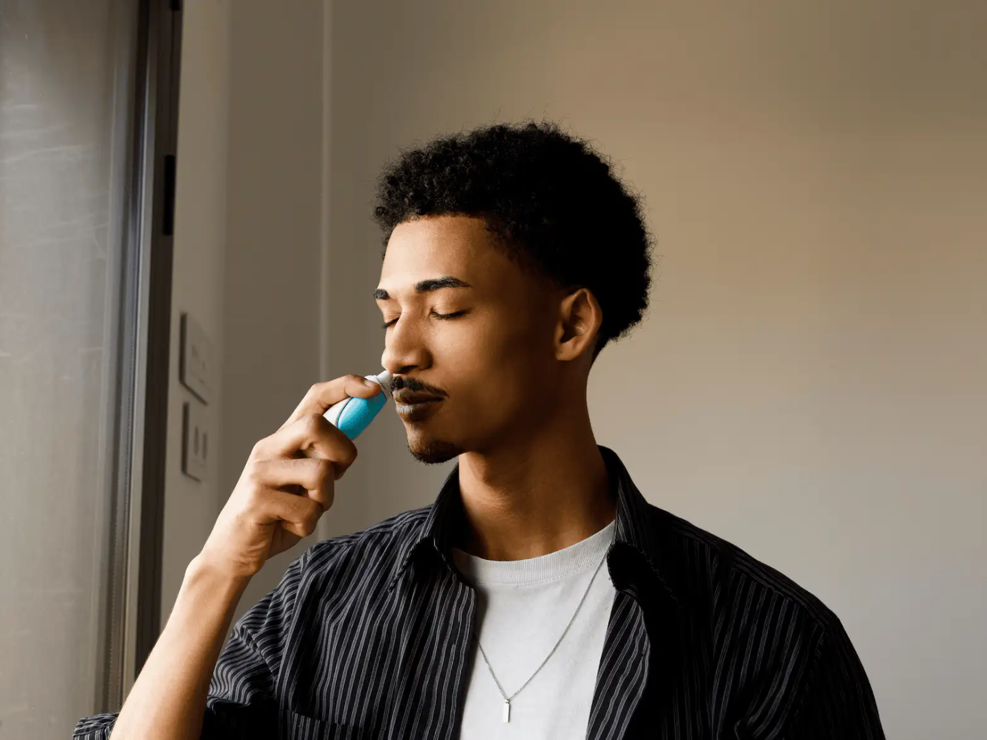 Adult self-administering Spravato esketamine nasal spray under clinical supervision for TRD treatment