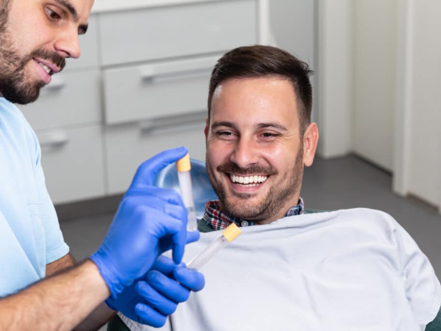 Clinician discussing PRP injection plan during a men's sexual health consultation