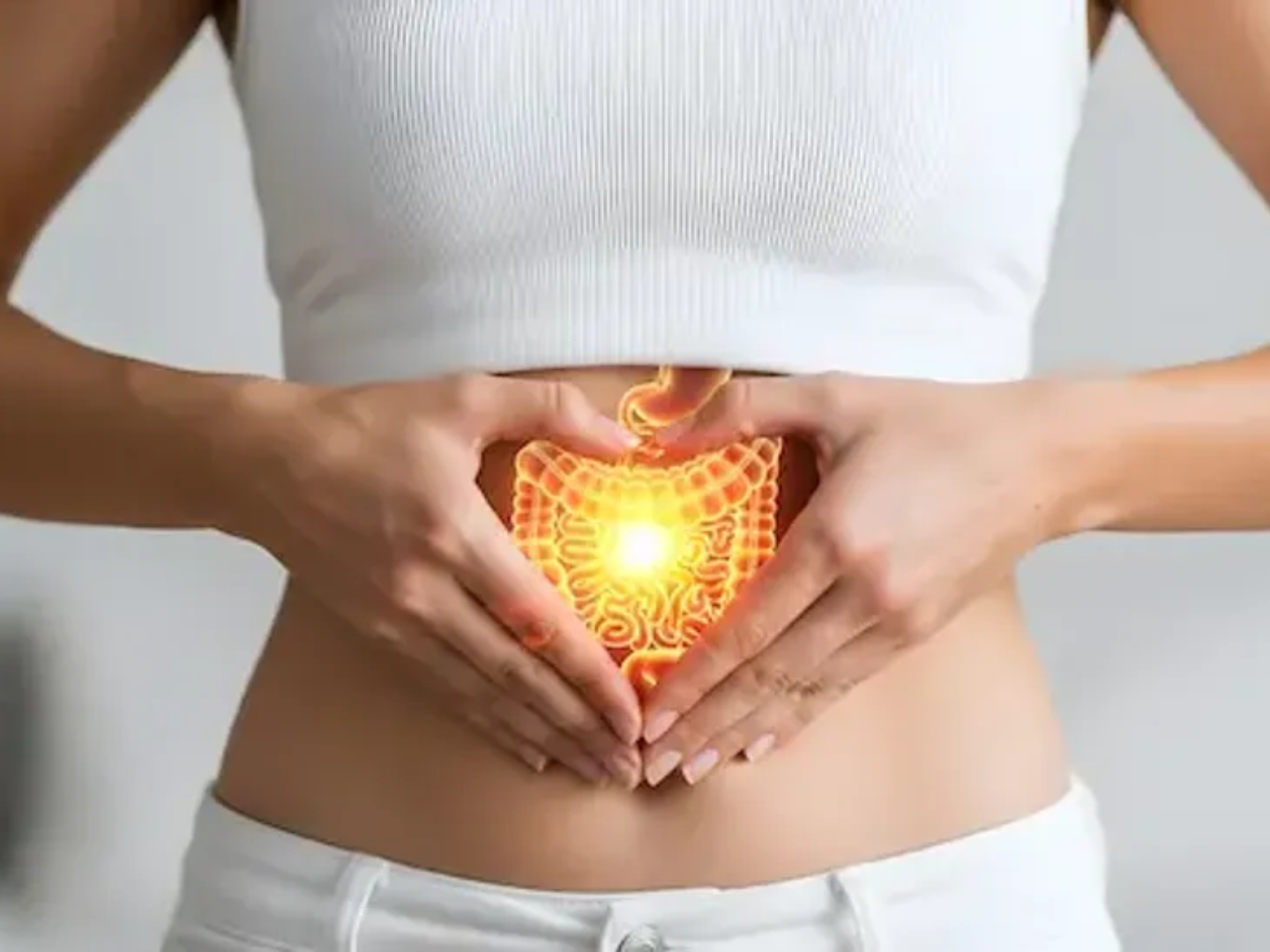 Person holding their abdomen with highlighted digestive system representing gastrointestinal health and digestive disorder treatment