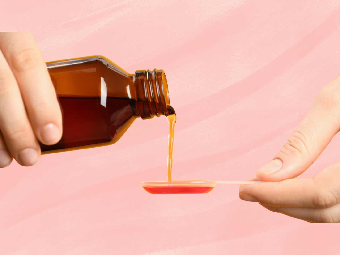 Liquid immune support supplement being poured into a measuring spoon representing nutritional support for immune health and inflammation balance