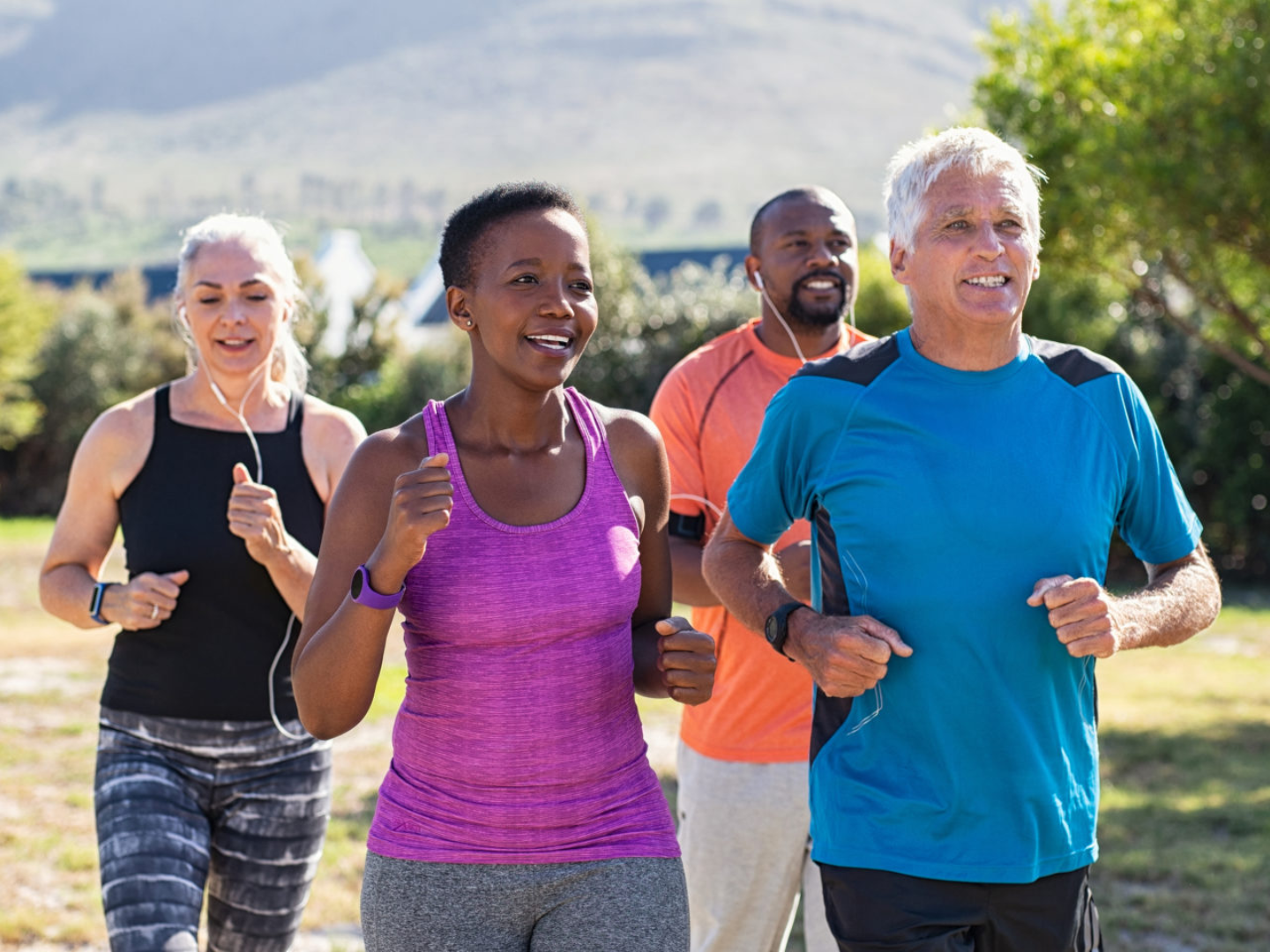 Group of adults jogging outdoors representing healthy lifestyle habits that support immune balance and autoimmune disease management