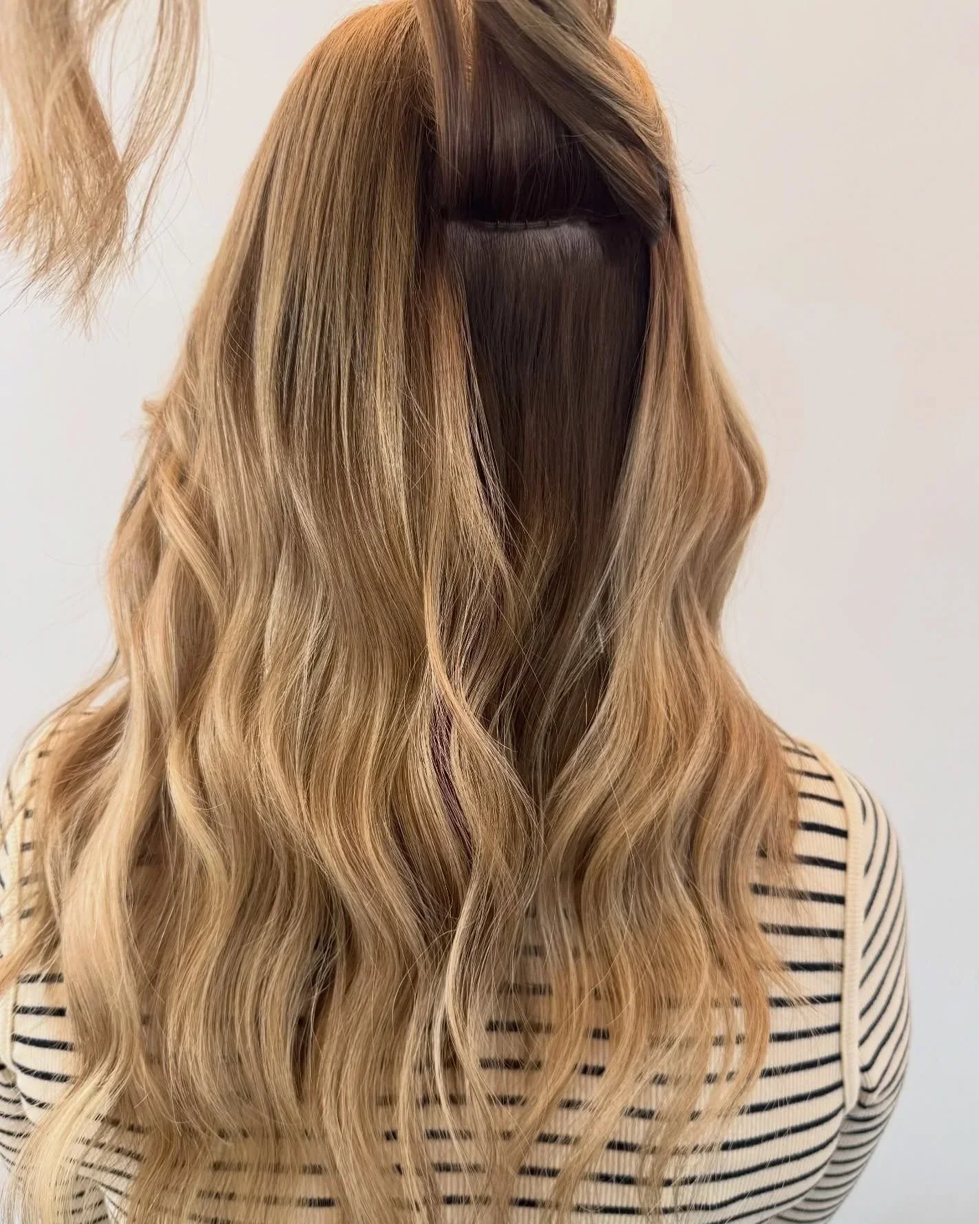 Seamless hair extensions for added length and fullness at TEAL Hair & Makeup Studio