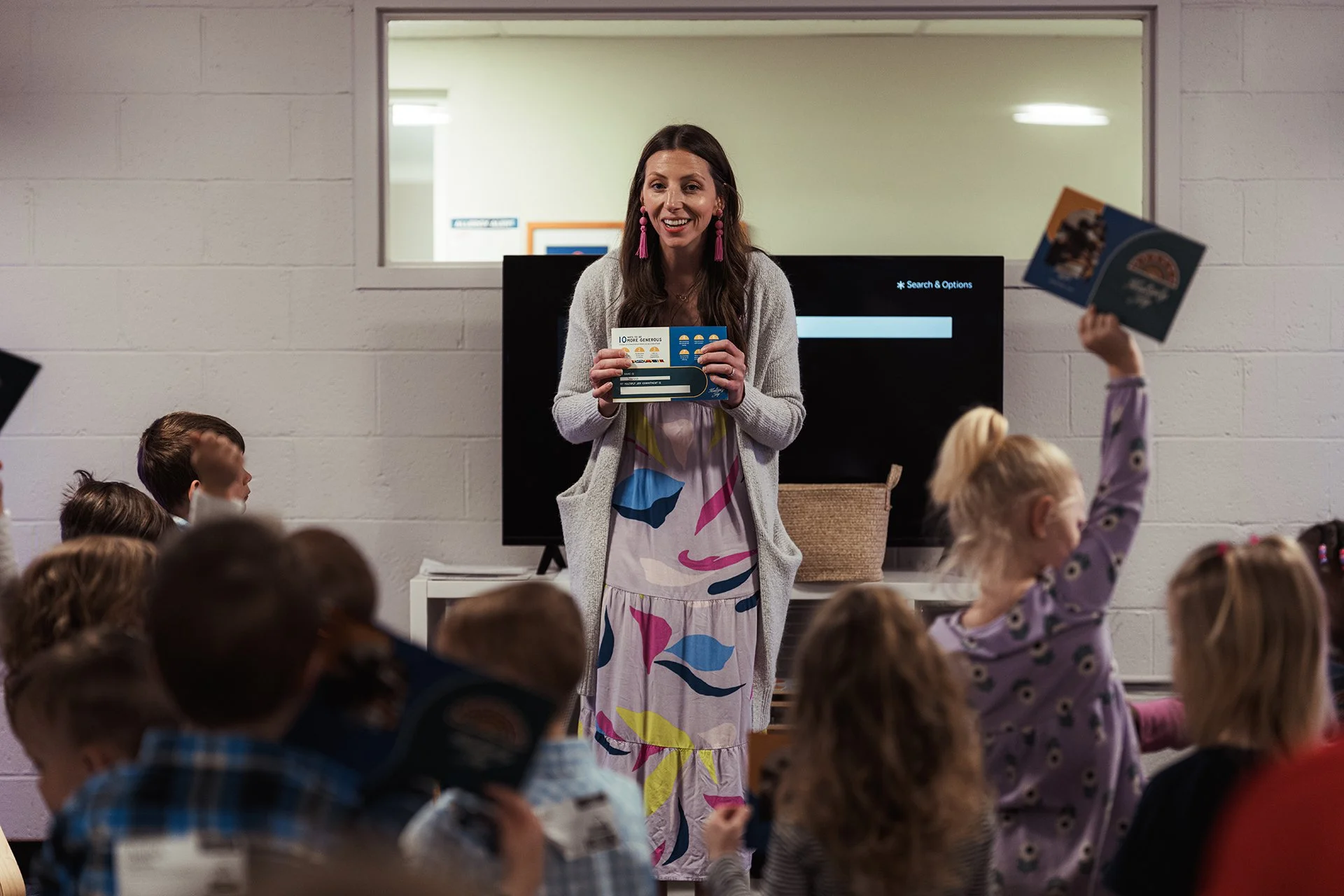 A young girl and boy playing together in a Mission Kids classroom