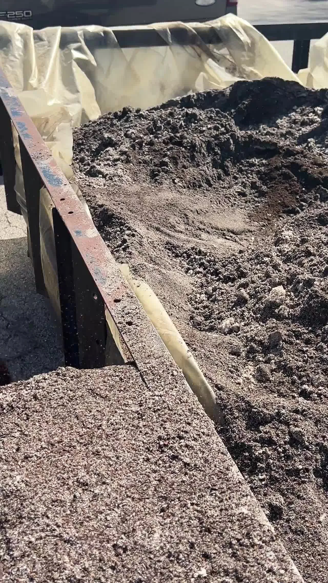 Sand-and-compost soil amendment in progress before sod installation on a Central Florida property near Lake Nona