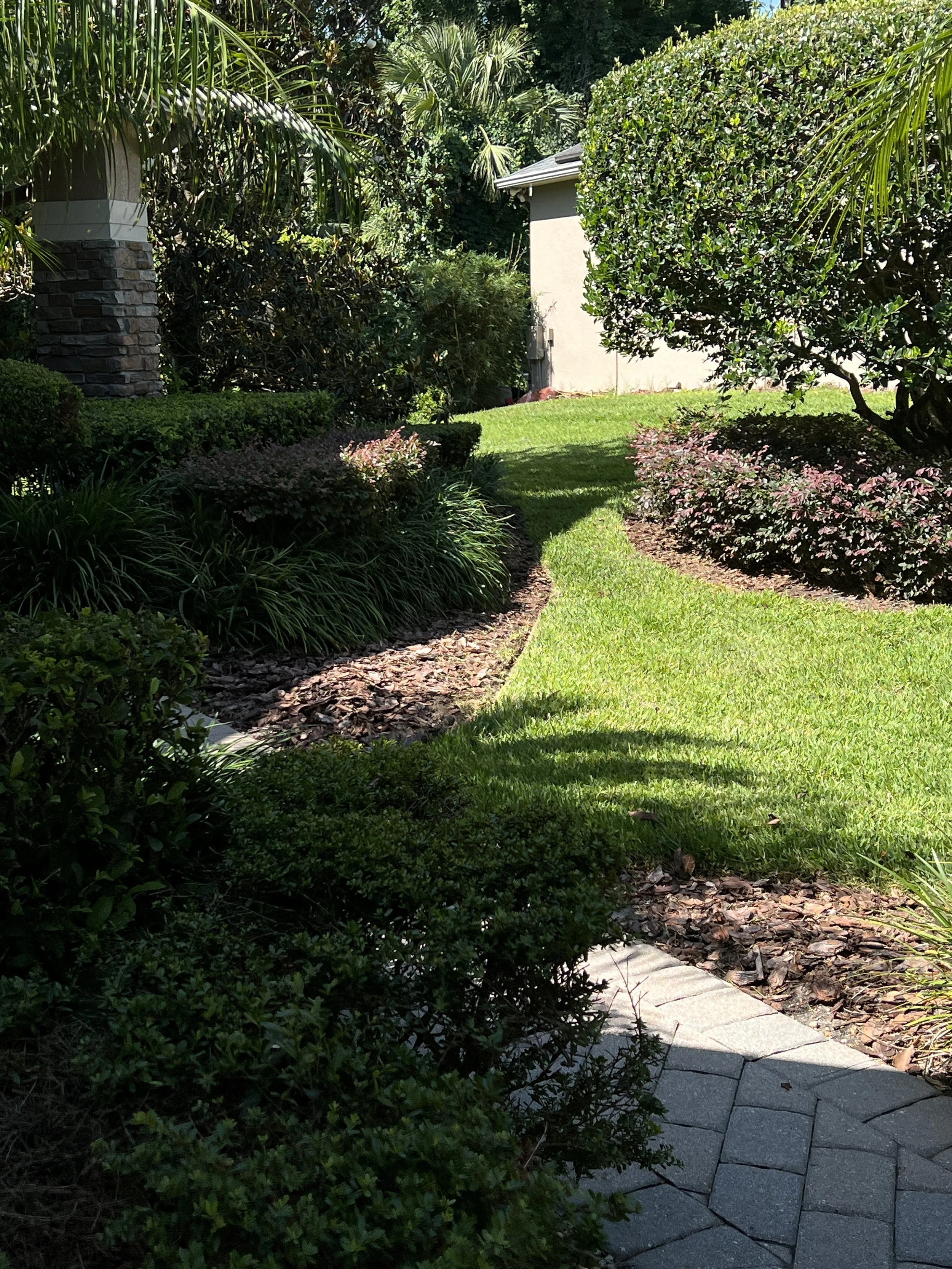 Sod and landscape-bed restoration around an estate walkway