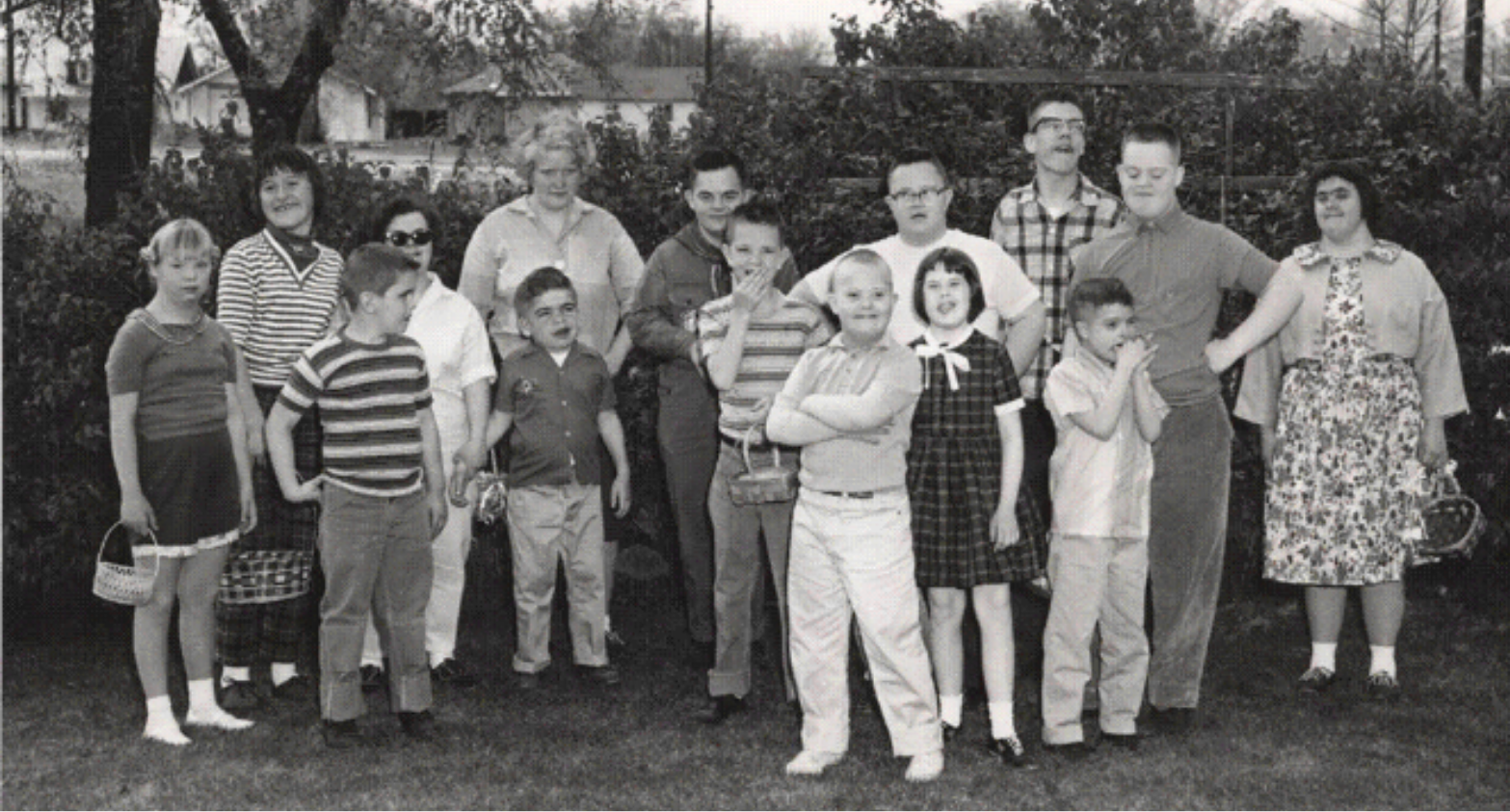 A black and white photo of children and young adults served by The Arc in its early years