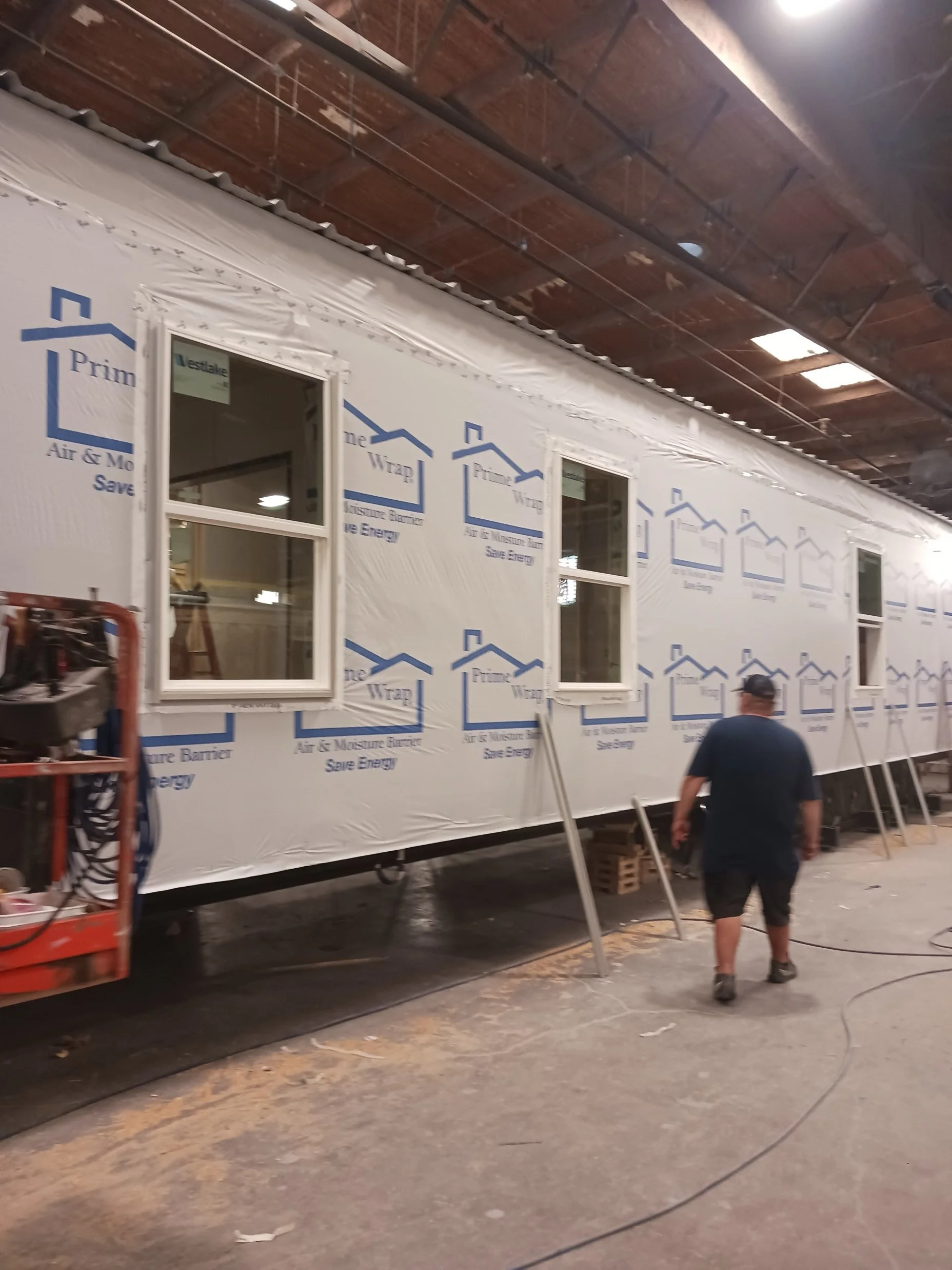 The intake center building under construction inside a workshop