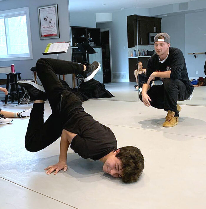 teenage boy breakdancing