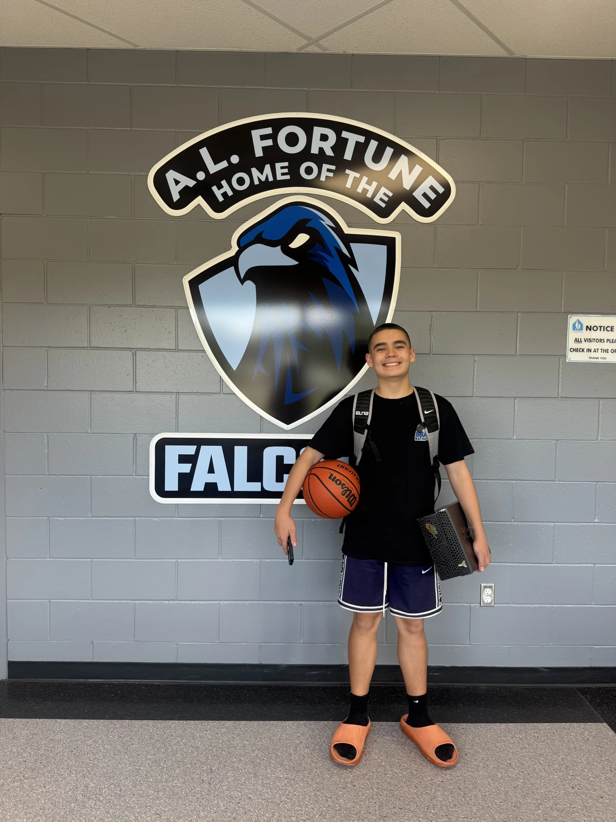 Grayson Eby smiling with a basketball in September 2026