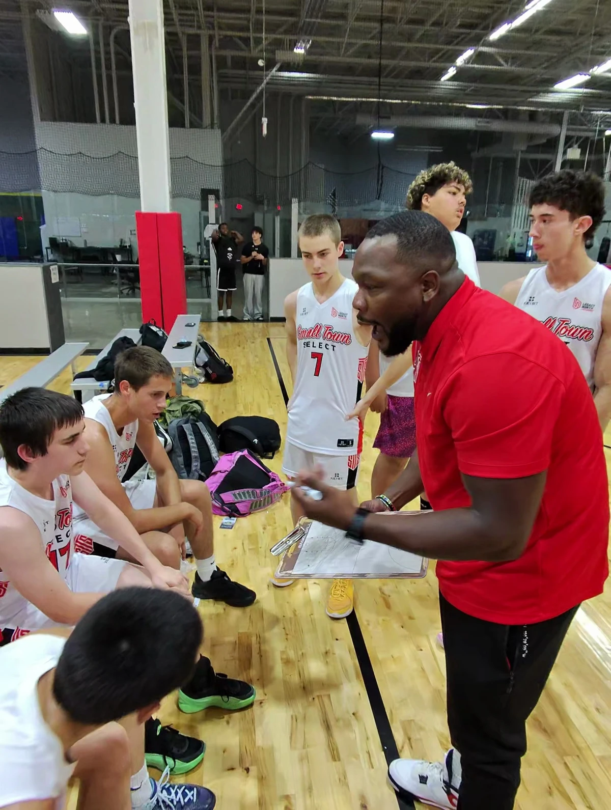 Russell Steplight coaching Small Town Select athletes with a clipboard