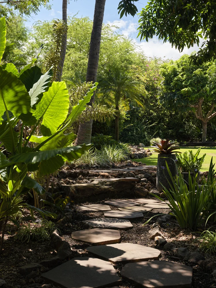 Hand-set stone terraces during a Blooming Gardens installation