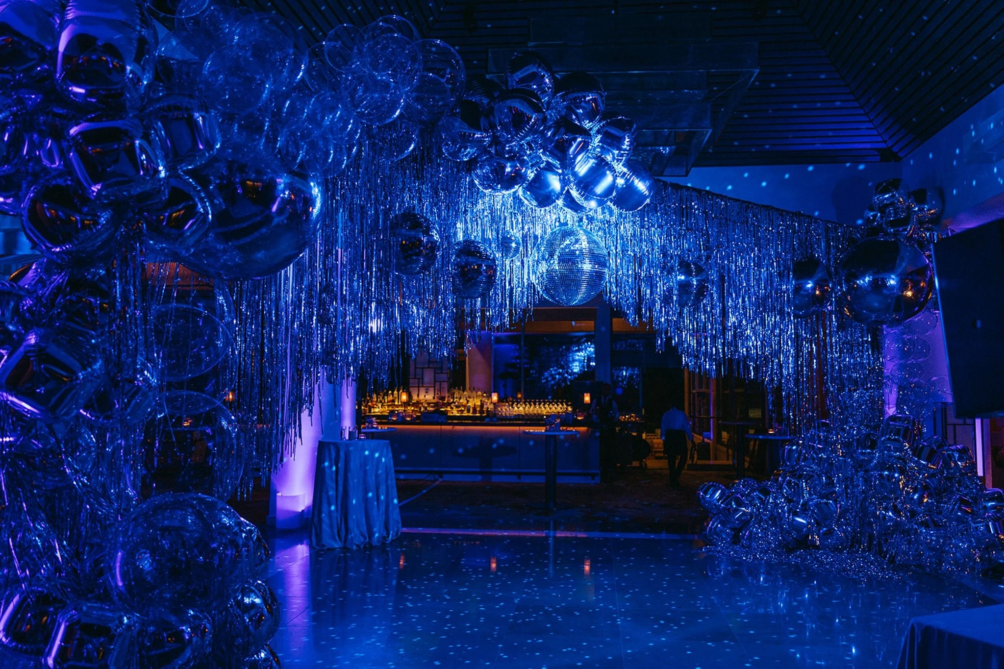 Dramatic disco ball and lighting installation for dance floor