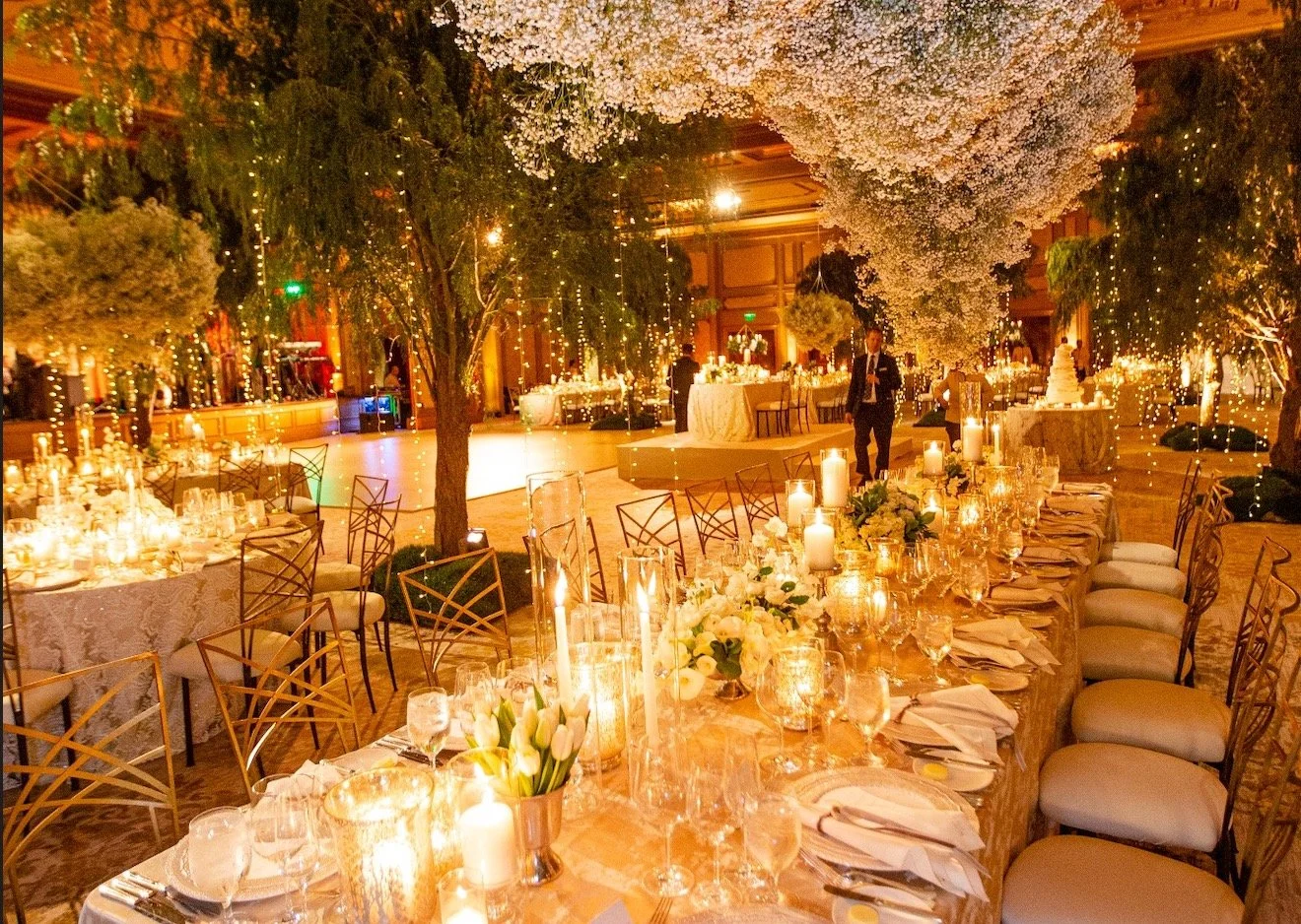 Amber wash twinkle lighting at wedding reception