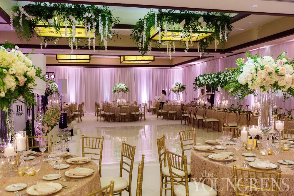 Blush uplighting around the ballroom dance floor at The Lodge at Torrey Pines wedding