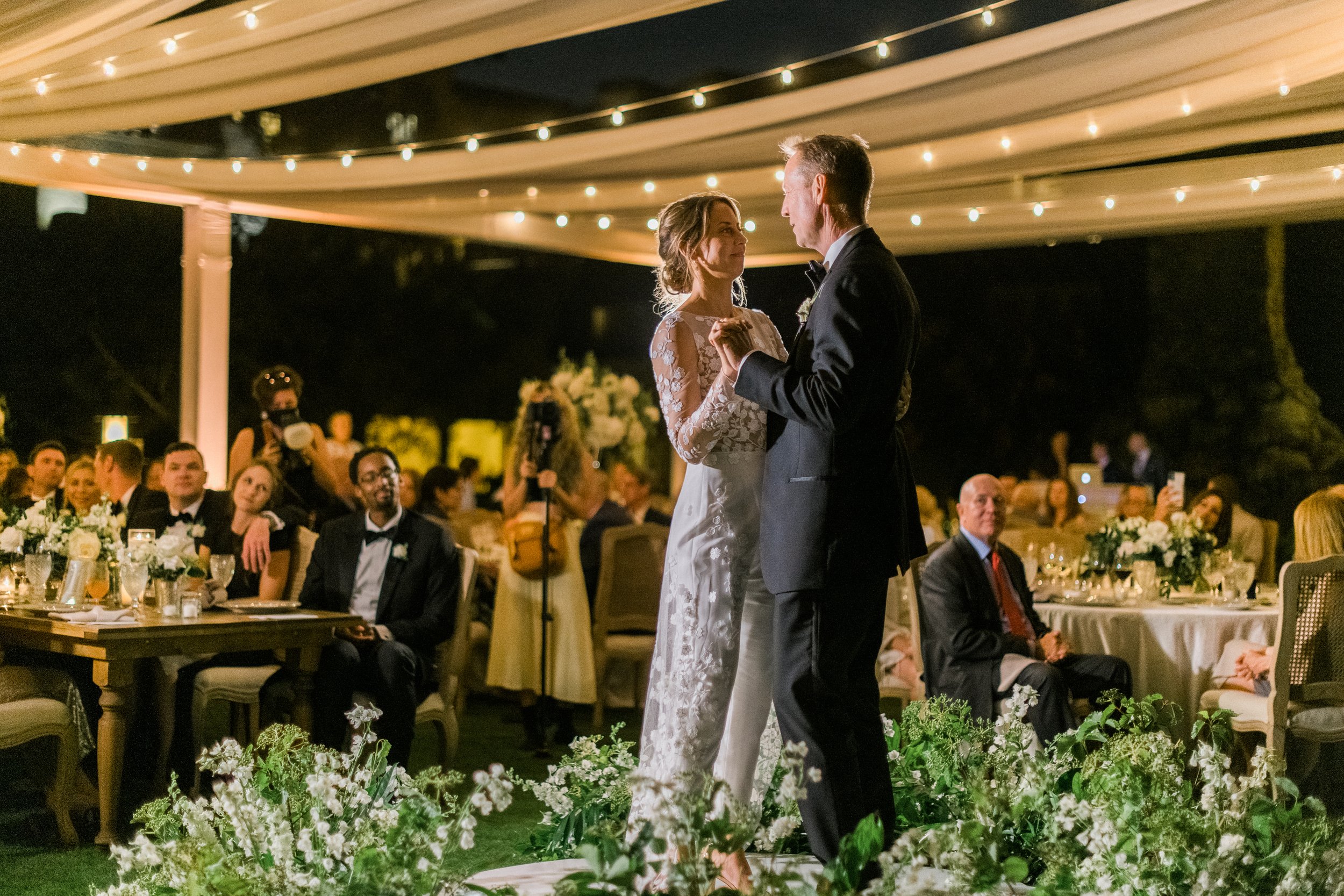 Aerial view of custom truss framework supporting market lights over reception