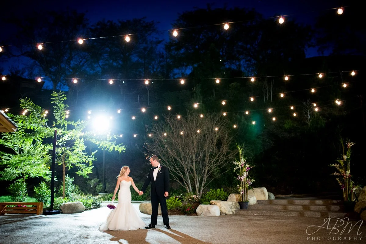 Ballroom first dance with market lights and warm uplighting