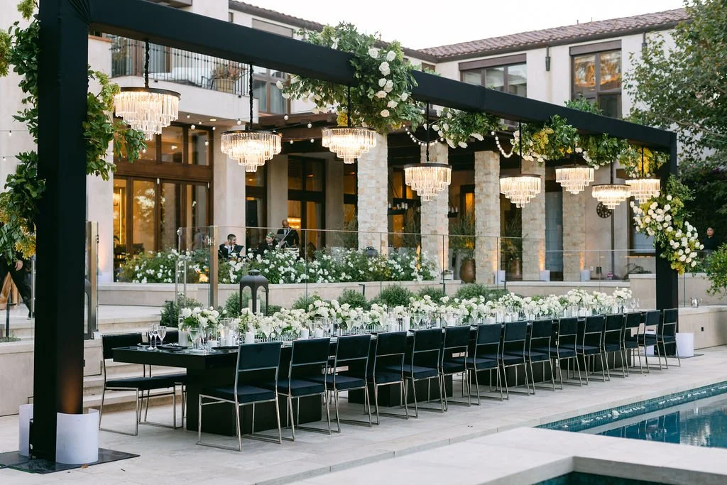Pin spot lighting on wedding cake at Newport Beach estate