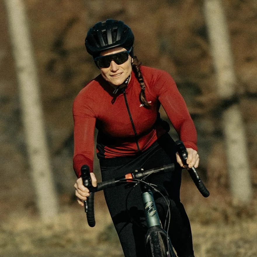 Dr Liz Mahon, HP3 sports nutritionist, riding her road bike on a woodland track