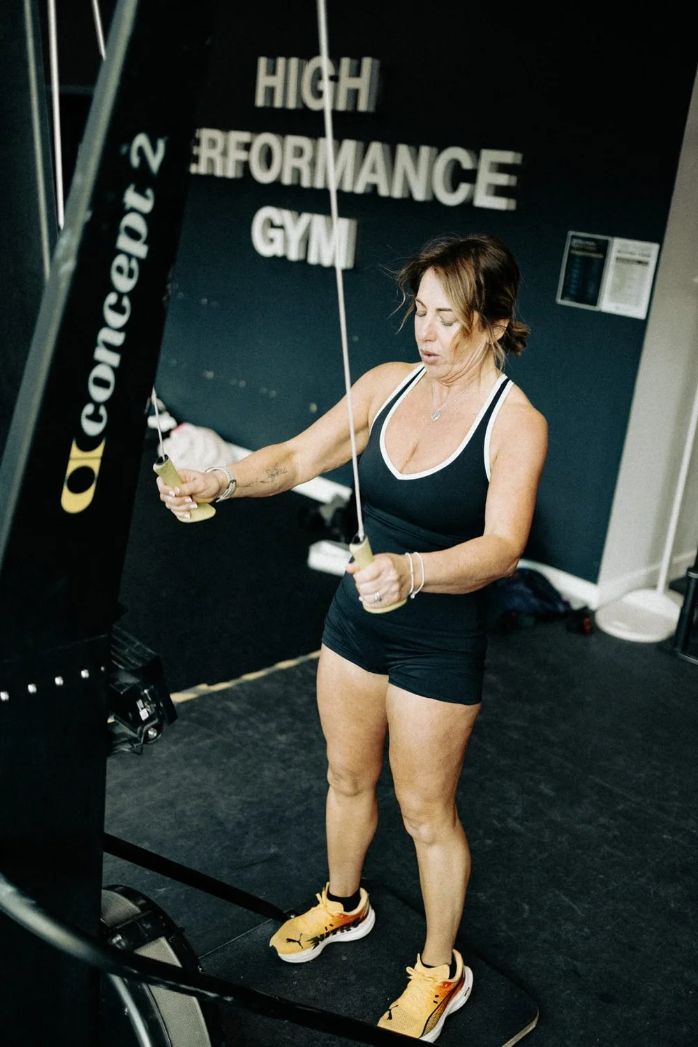 An athlete performing a single-arm cable row