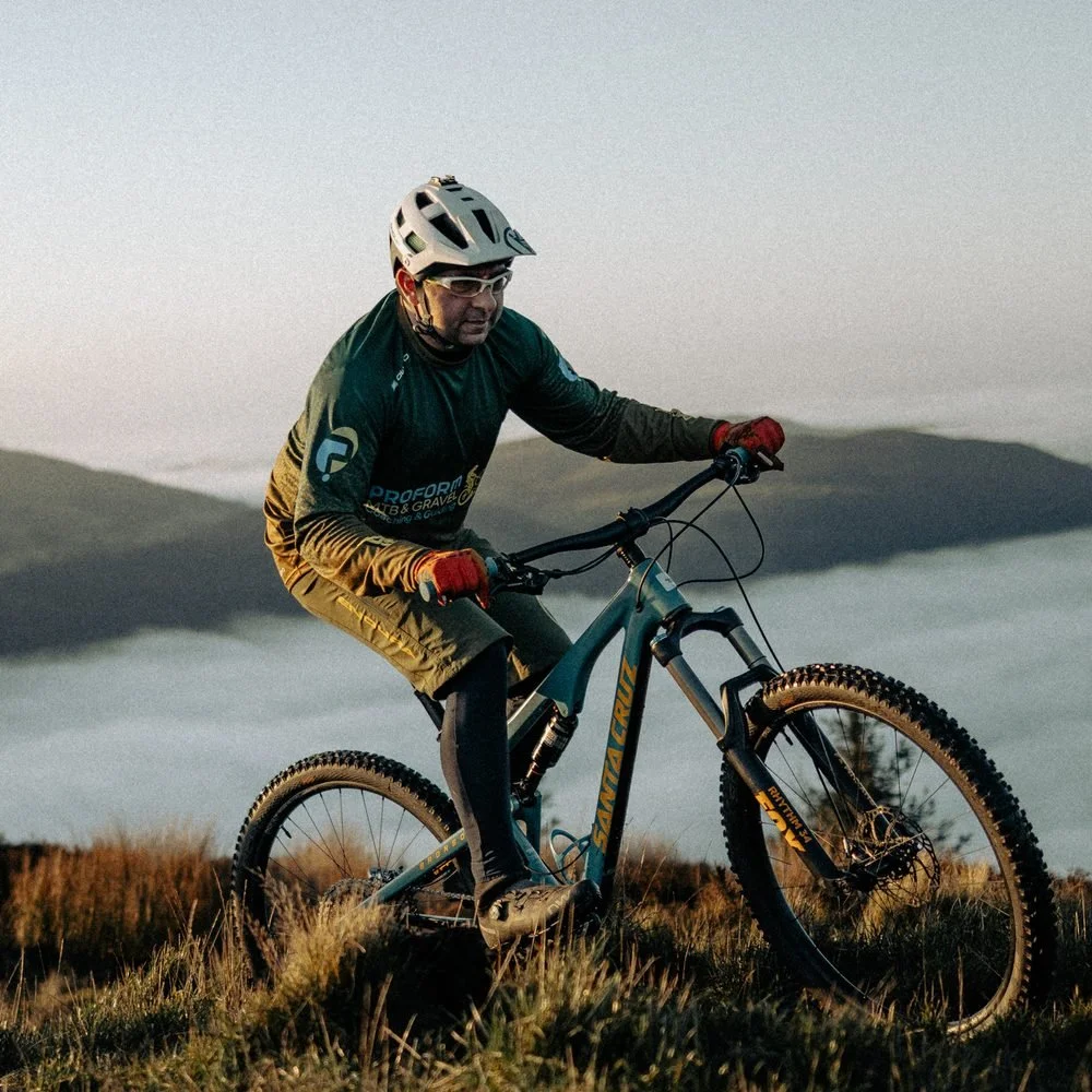 Dr Howard Hurst, HP3 nutritionist and sports scientist, on his mountain bike on a hilltop above a cloud inversion