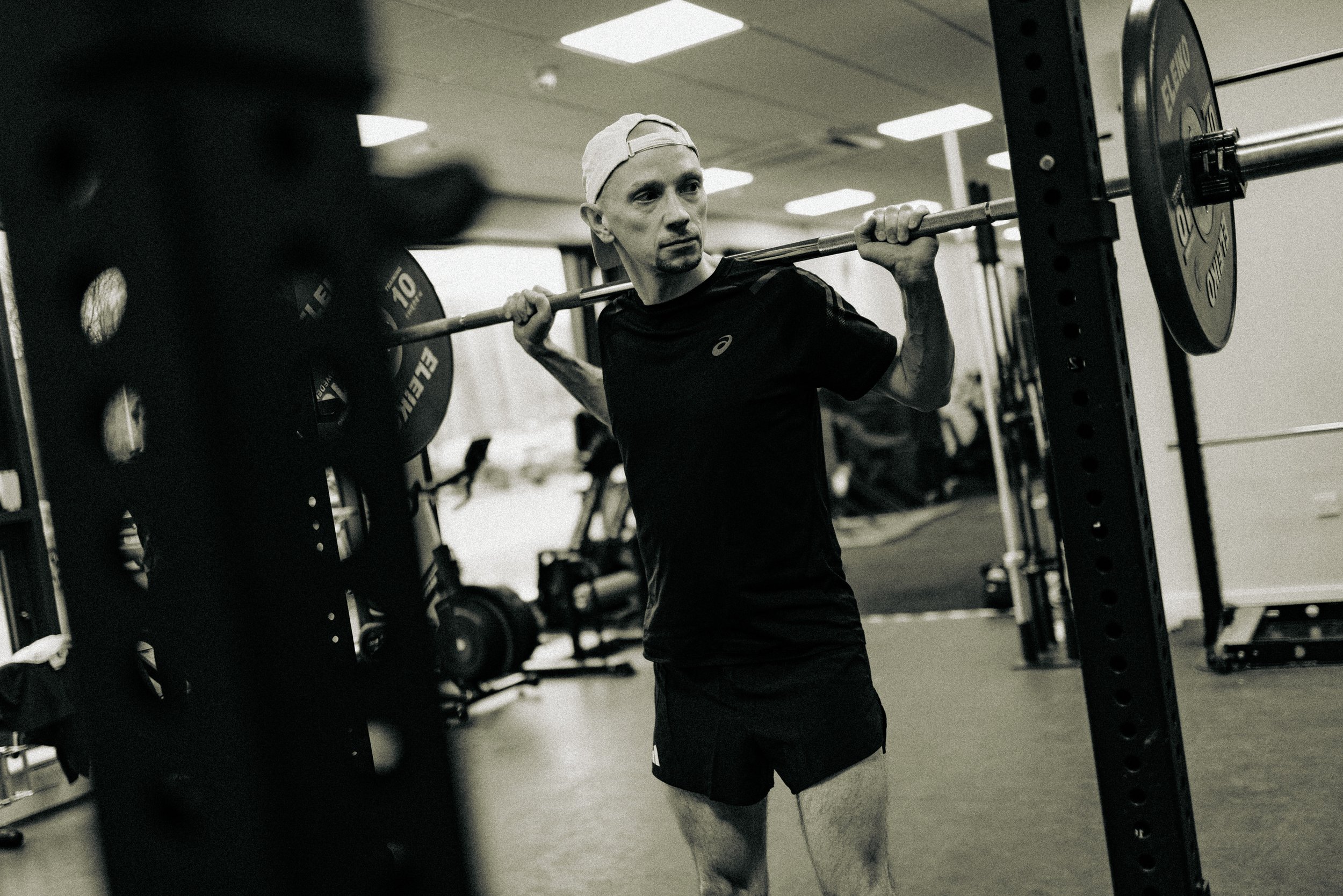 Endurance athlete performing strength training with a barbell